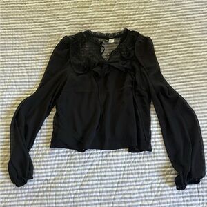 Black blouse with lace.
